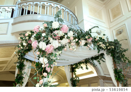 Wedding chuppah decorated with fresh flowers 53619854