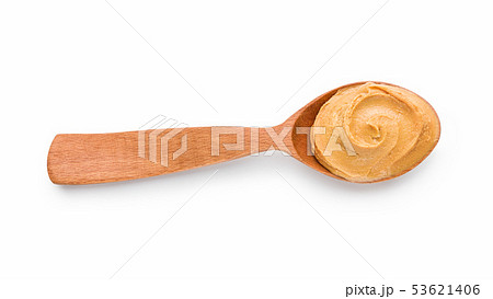 Spoon with peanut butter 53621406