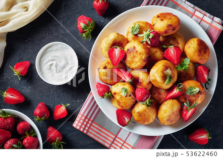 cottage cheese sweet donuts served with berries 53622460