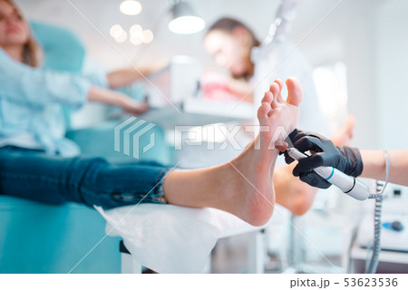 Beautician salon, foot polish procedure 53623536
