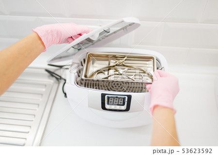 Cosmetologist cleans equipment, tools cleaning Cosmetologist cleans equipment, tools cleaning 53623592