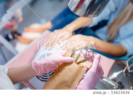 Cosmetology salon, manicure, polishing procedure 53623636