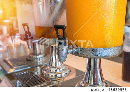 fruit juice in water cooler for breakfast  53629973