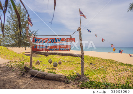 Natural tropical sandy beach and calm sea landscape with trees and blue sky background. Mai Khao 53633069