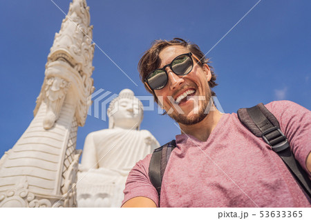 Man tourist on background of Big Buddha statue Was built on a high hilltop of Phuket Thailand Can be 53633365