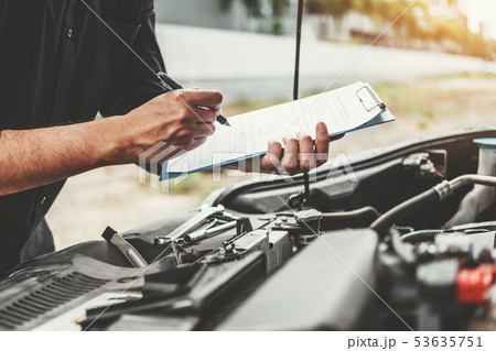 Auto mechanic working in garage Technician holding Auto mechanic working in garage Technician holding 53635751