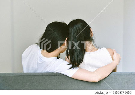 Girlfriends hugging together to encourage. Girlfriends hugging together to encourage. 53637936