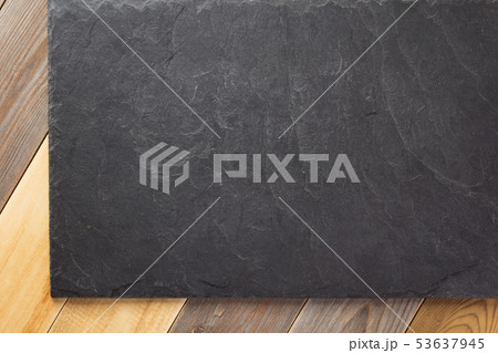 slate stone at wooden background slate stone at wooden background 53637945