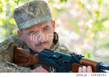 Ukrainian soldier in the battle with a rifle Ukrainian soldier in the battle with a rifle 53638291