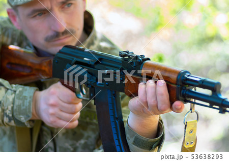 Ukrainian soldier in the battle with a rifle 53638293