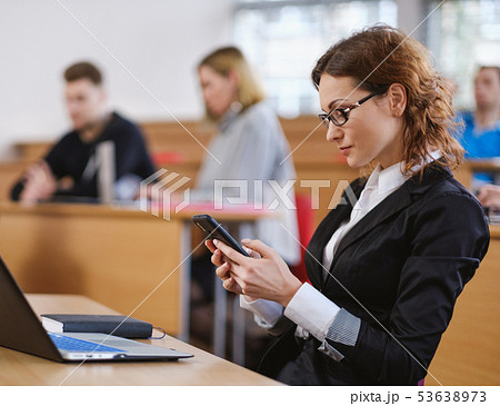 Multinational group of students in an auditorium 53638973