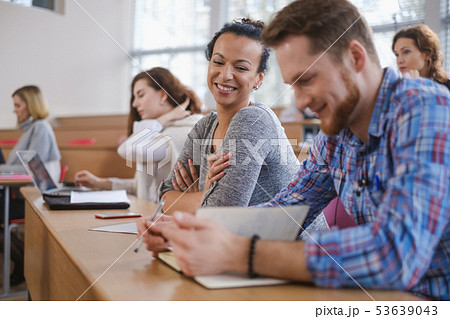 Multinational group of students in an auditorium 53639043