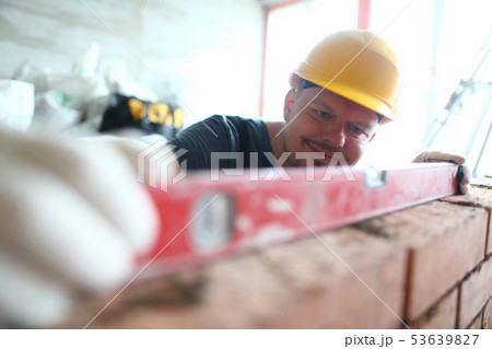 Smiling man in hardhat 53639827