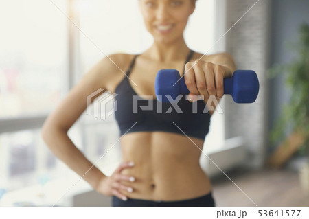 Young sportswoman doing fitness exercises at sport Young sportswoman doing fitness exercises at sport 53641577