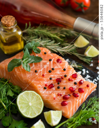 Salmon with vegetables, olive oil and herbs Salmon with vegetables, olive oil and herbs 53646082