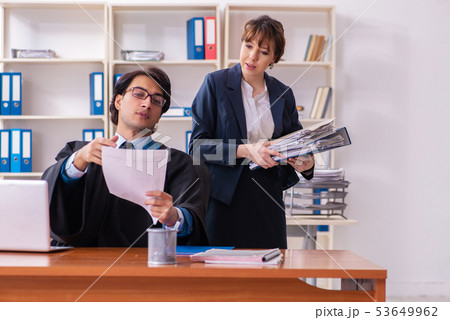 Two lawyers working in the office 53649962