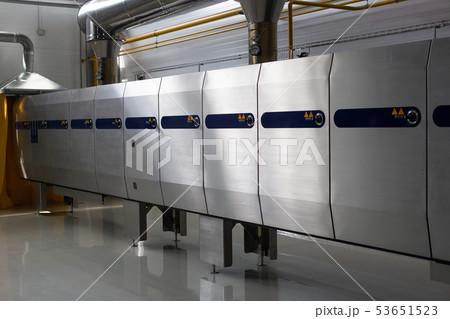 Ice cream production line. Conveyor production. Oven for food production. Selective focus. Ice cream production line. Conveyor production. Oven for food production. Selective focus. 53651523