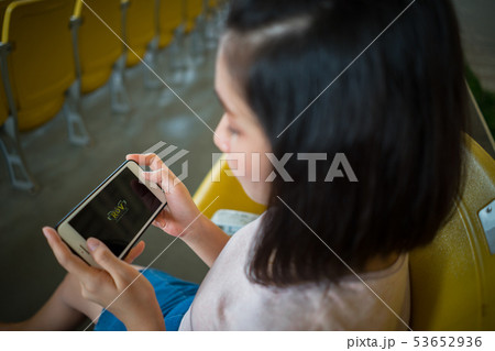 Woman playing ROV online computer game smartphone. Woman playing ROV online computer game smartphone. 53652936
