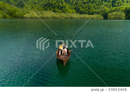 Young Couple In A Boat On The Background Of A Lake. 53653409