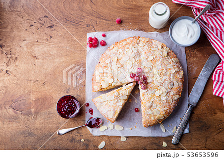 Almond and raspberry cake, Bakewell tart. . Top view. Copy space. Wooden background. Almond and raspberry cake, Bakewell tart. . Top view. Copy space. Wooden background. 53653596
