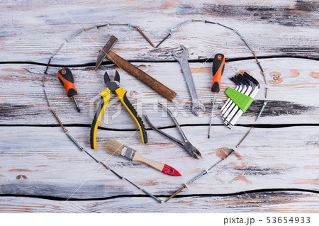 Various construction tools on wooden background. 53654933