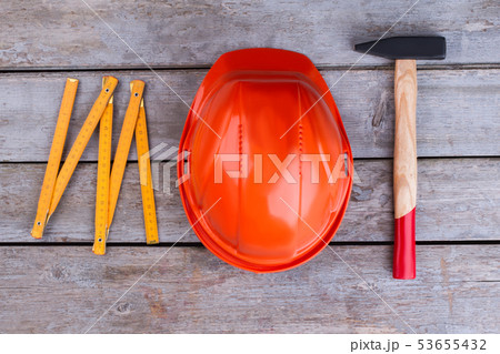 Safety helmet, hammer and folding ruler. 53655432