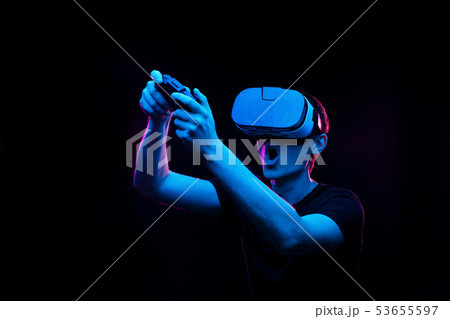 Man with virtual reality headset is playing game. Man with virtual reality headset is playing game. 53655597