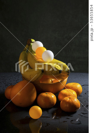 Still life with orange, wet tangerines, colored 53655854
