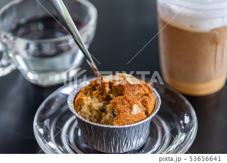 Banana cupcake with ice milk tea and water drink Banana cupcake with ice milk tea and water drink 53656641