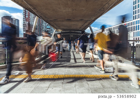Motion blur of Asian people walking on walkway 53658902
