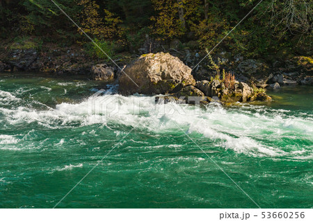The turquoise water of the Skagit River descending with force The turquoise water of the Skagit River descending with force 53660256