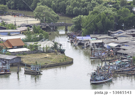 Fishing boats parked in river access to the sea. 53665543
