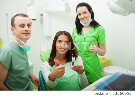 Patient in dentistry. Pretty woman visiting her dentist in clinic 53666956