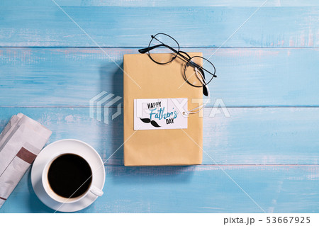Happy Fathers Day, gift box with a cup of coffee Happy Fathers Day, gift box with a cup of coffee 53667925