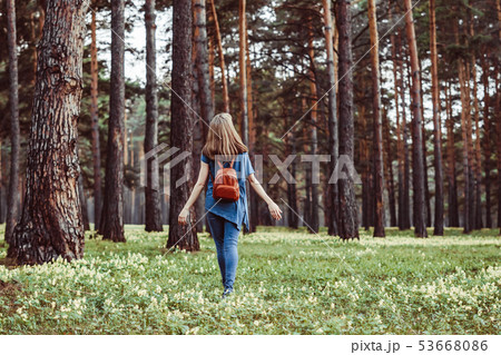 girl walking in the woods 53668086