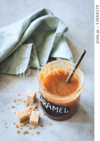 Homemade soft caramel in jar 53668370