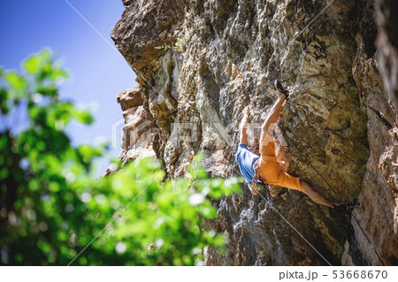 Man climbs rock. 53668670