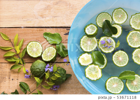 kaffir lime slice float on the water with flower  53671118