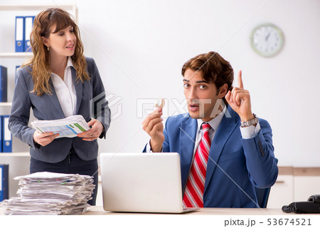 Deaf employee using hearing aid talking to boss Deaf employee using hearing aid talking to boss 53674521