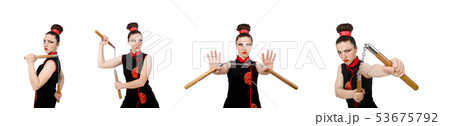 Funny woman with nunchucks isolated on white 53675792