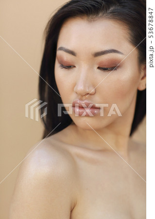 Beautiful asian model with long dark hair Beautiful asian model with long dark hair 53678847