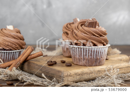 brown cupcakes with cocoa cream, cinnamon and 53679000