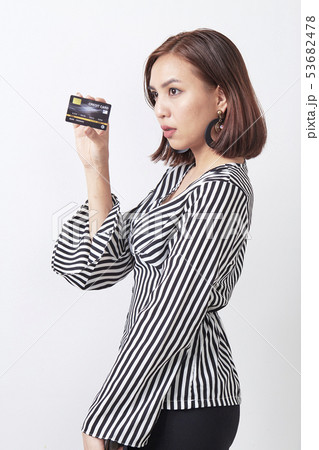 Asian woman holding credit card 53682478