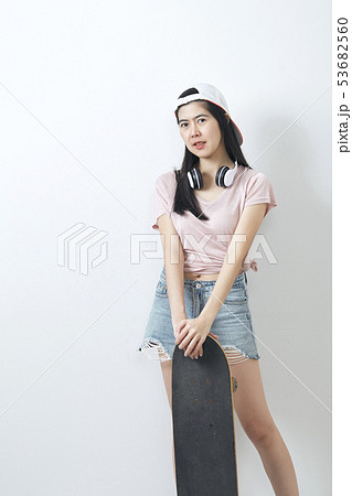 Beautiful asian girl holding skateboard 53682560