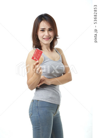 Young smiling  asian woman presenting credit card 53682853