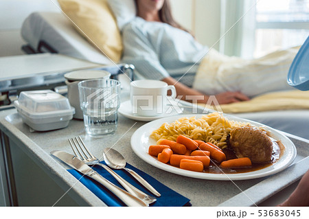 Food delivered to a patient in hospital bed Food delivered to a patient in hospital bed 53683045