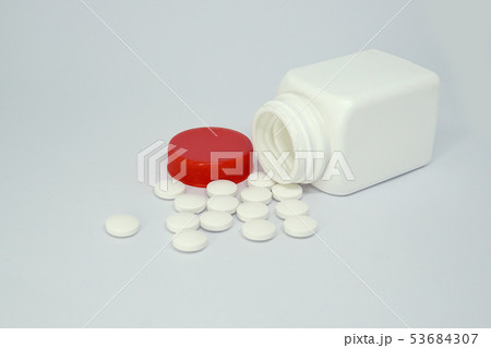 Medicine bottle and pills isolated on white Medicine bottle and pills isolated on white 53684307