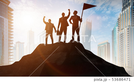 Businessmen in achievement and teamwork concept 53686471
