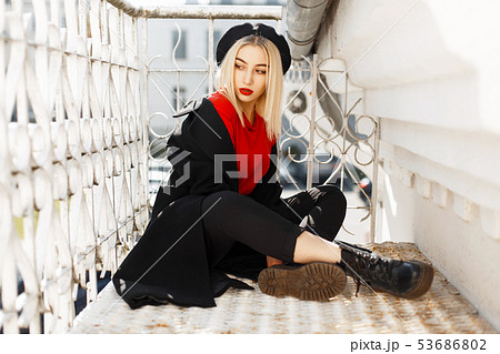 beautiful fashionable woman in a black coat beautiful fashionable woman in a black coat 53686802