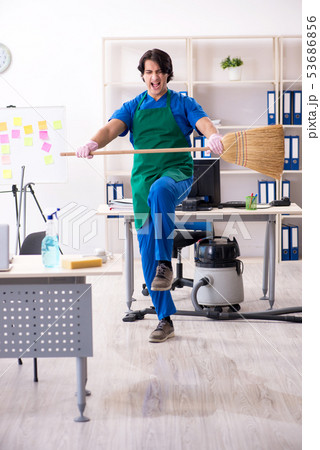 Male handsome professional cleaner working in the office Male handsome professional cleaner working in the office 53686856